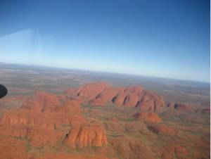 The impressive Olgas with Ayers Rock in the background 